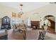 Bright living room featuring a fireplace, chandelier, and elegant furnishings at 400 W Par St, Orlando, FL 32804