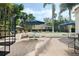 Expansive patio with spiral staircase, dining area and lush greenery, perfect for outdoor entertaining at 400 W Par St, Orlando, FL 32804