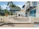 Outdoor patio with spiral staircase, dining set and lush greenery, creating a perfect spot for al fresco dining at 400 W Par St, Orlando, FL 32804