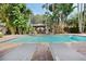 Relaxing pool area with gazebo and fireplace, surrounded by lush tropical landscaping at 400 W Par St, Orlando, FL 32804