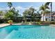 Inviting pool area with lounge chairs and umbrellas surrounded by lush landscaping for a private outdoor retreat at 400 W Par St, Orlando, FL 32804