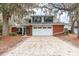 Charming two-story home featuring a red brick facade and a two-car garage at 4309 Enright Ct, Winter Park, FL 32792