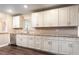 Bright kitchen with white cabinets, stainless steel appliances, and granite countertops at 4309 Enright Ct, Winter Park, FL 32792