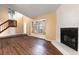 Spacious living room featuring a fireplace, hardwood floors, and a cozy window seat at 4309 Enright Ct, Winter Park, FL 32792