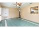 Cozy sunroom features tiled floor, ceiling fan, and a view into kitchen at 4309 Enright Ct, Winter Park, FL 32792