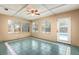 Bright sunroom with tile flooring and multiple windows overlooking the pool at 4309 Enright Ct, Winter Park, FL 32792