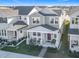 Aerial front exterior view of two-story home with covered front porch and landscaped yard at 431 Scotsmans Pl, Debary, FL 32713