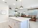 Open kitchen featuring quartz countertops, stainless steel appliances, and an island with pendant lighting at 431 Scotsmans Pl, Debary, FL 32713