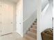 Hallway with staircase and neutral color scheme at 431 Scotsmans Pl, Debary, FL 32713