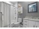 Bathroom featuring a shower-tub combination, white vanity with granite countertop, and stylish tile accents at 448 Douglas Edward Dr, Ocoee, FL 34761