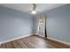 Neutral bedroom with a ceiling fan and light-filled window at 448 Douglas Edward Dr, Ocoee, FL 34761