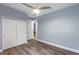 Cozy bedroom with wood floors, large closet and light-filled window at 448 Douglas Edward Dr, Ocoee, FL 34761