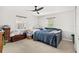 This bedroom has lots of sunlight and a ceiling fan at 465 Mandalay Rd, Orlando, FL 32809