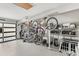 A spacious garage includes bike racks, storage shelving, and an epoxy floor at 465 Mandalay Rd, Orlando, FL 32809