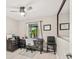 Well-lit home office featuring a ceiling fan, a desk, and a mirror at 465 Mandalay Rd, Orlando, FL 32809