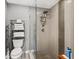 Shower stall with a glass door, grey tiling, and metal fixtures at 465 Mandalay Rd, Orlando, FL 32809