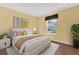 Inviting bedroom features natural light and neutral decor for a serene and personal space at 4801 Coachmans Dr # 2, Orlando, FL 32812