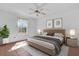 Comfortable bedroom featuring a window for natural light and neutral decor for peaceful relaxation at 4801 Coachmans Dr # 2, Orlando, FL 32812