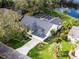 Aerial view of home showing mature landscaping, a spacious yard, and an inviting outdoor space at 5219 Hammock Cir, St Cloud, FL 34771