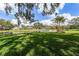 Scenic backyard view featuring a serene pond and lush green lawn, perfect for outdoor enjoyment at 5219 Hammock Cir, St Cloud, FL 34771