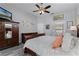 Cozy bedroom featuring wood floors and ensuite bathroom at 5219 Hammock Cir, St Cloud, FL 34771