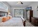 Relaxing bedroom featuring natural light from the sliding glass doors at 5219 Hammock Cir, St Cloud, FL 34771