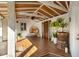 Cozy covered patio featuring wood-look tile flooring, a unique chair, and ample natural light at 533 Balmoral Rd, Winter Park, FL 32789