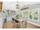 Dining room with natural lighting, rustic wood table, and decorative accents at 533 Balmoral Rd, Winter Park, FL 32789