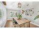 Bright dining room with vaulted ceiling, custom light fixture, and large windows at 533 Balmoral Rd, Winter Park, FL 32789