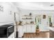 Cozy kitchen nook with bar and display shelving, and outdoor view at 533 Balmoral Rd, Winter Park, FL 32789