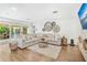 Comfortable living room featuring an L-shaped couch, a decorative fireplace, and rustic accents at 533 Balmoral Rd, Winter Park, FL 32789