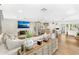 Open-concept living room flowing into the kitchen featuring modern decor and wood-look tile flooring at 533 Balmoral Rd, Winter Park, FL 32789