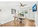 Bright home office with a wooden desk, ceiling fan, and laminate wood flooring at 533 Balmoral Rd, Winter Park, FL 32789