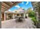 Elegant outdoor patio featuring a dining table under a stylish sunshade, perfect for entertaining at 533 Balmoral Rd, Winter Park, FL 32789