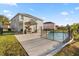 A backyard pool with a safety fence is a great place to relax and enjoy the outdoors at 5361 Tortuga Dr, Orlando, FL 32837