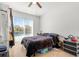 Bedroom with tile floor, ceiling fan, and sliding glass door to a pool area at 5361 Tortuga Dr, Orlando, FL 32837