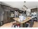 Spacious kitchen featuring dark wood cabinetry, granite countertops, and stainless steel appliances at 5361 Tortuga Dr, Orlando, FL 32837