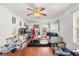 Cozy living room with hardwood floors and a ceiling fan at 5361 Tortuga Dr, Orlando, FL 32837