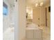 Beautiful bathroom featuring marble accents, a soaking tub, and a glass shower at 5558 Brookline Dr, Orlando, FL 32819