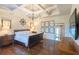 Spacious bedroom with decorative ceiling beams and hardwood flooring at 5558 Brookline Dr, Orlando, FL 32819