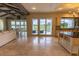 Open living space boasts travertine tile floors, golf course views and an island kitchen at 5558 Brookline Dr, Orlando, FL 32819