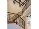 Elegant staircase features detailed iron railings, wood steps and accents, and an open design at 5558 Brookline Dr, Orlando, FL 32819