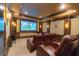 Home theater with plush leather seating and state-of-the-art screen for immersive entertainment experiences at 5558 Brookline Dr, Orlando, FL 32819