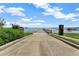 Community boat ramp leading to the lake, set against a blue sky with scattered clouds at 644 Strihal Loop, Oakland, FL 34787