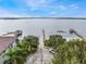 An aerial view of a boat ramp and docks on the lake, adjacent to a beautiful property at 644 Strihal Loop, Oakland, FL 34787