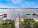 A boat ramp and docks on the lake, backed by trees and a clear sky at 644 Strihal Loop, Oakland, FL 34787