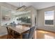 Bright dining area with a view of the screened lanai and natural light at 644 Strihal Loop, Oakland, FL 34787