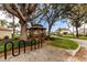 Charming community gazebo surrounded by trees and greenery, provides a peaceful outdoor gathering spot at 644 Strihal Loop, Oakland, FL 34787