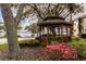 Picturesque community gazebo with a lake view, perfect for relaxation and community events at 644 Strihal Loop, Oakland, FL 34787