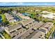 Aerial view of townhomes with parking and water view in a well maintained planned community at 696 Orange Belt Loop, Winter Garden, FL 34787